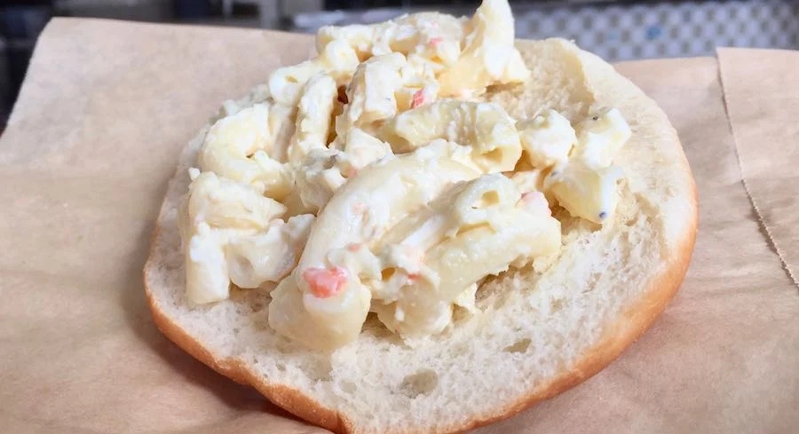 macaroni salad on a hamburger bun