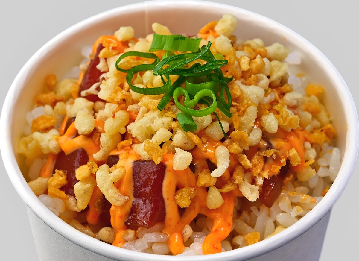 poke topped with bubu arare in a white cup
