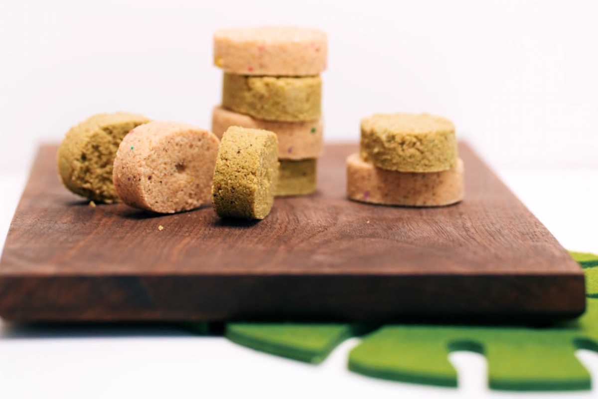 polvoron shortbread cookies on a brown cutting board Filipino Fiesta