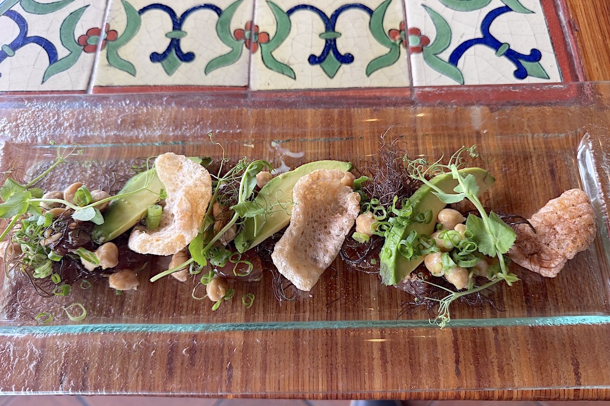 ahi poke and chicharonnes with Natto on glass plate