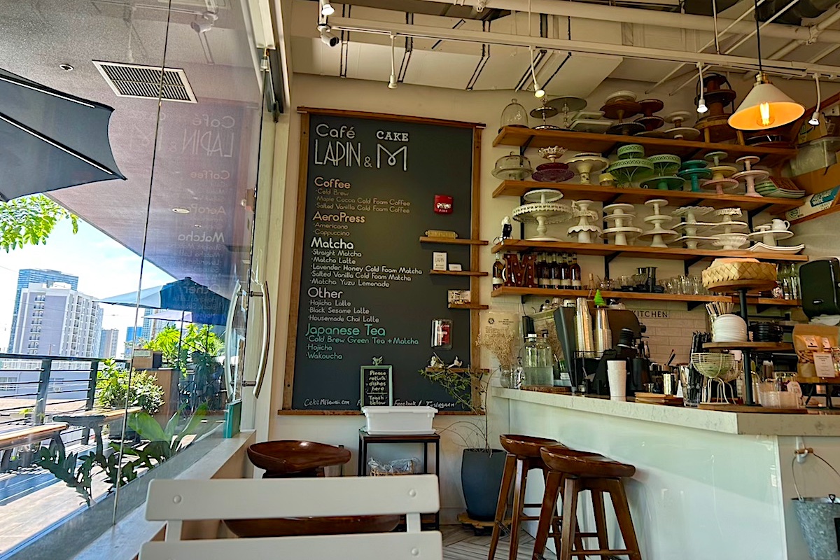 tables and chalkboard menu in cafe interior