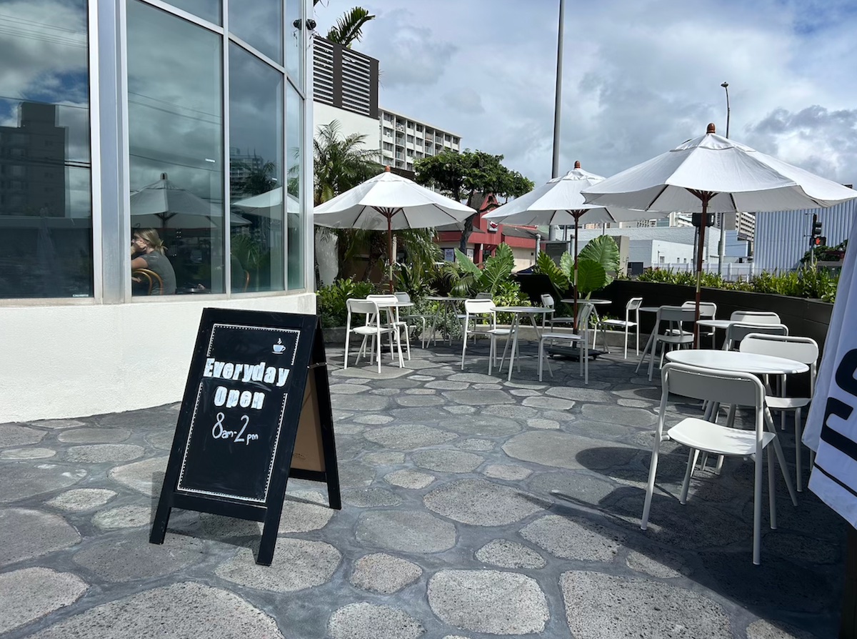 chairs and tables on a flagstone cafe patio