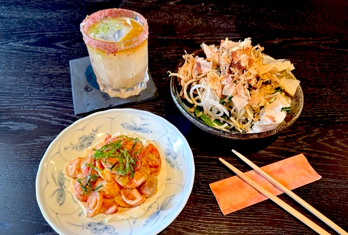 cocktail and assorted dishes at little plum