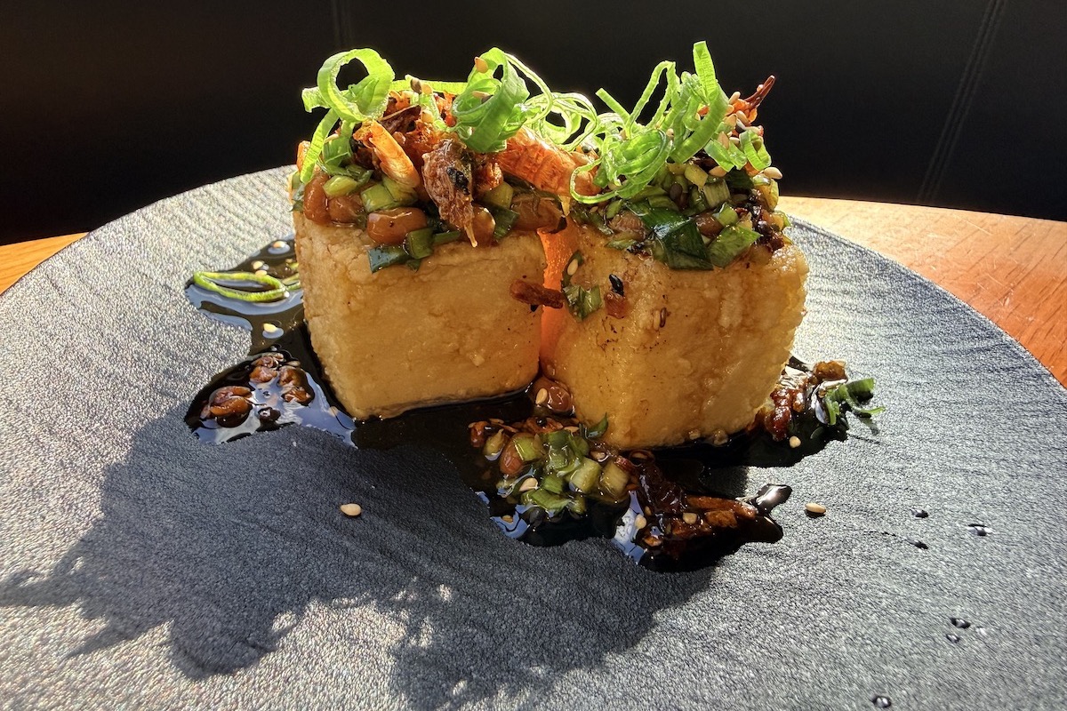 cubes of crispy tofu with natto and green onion topping